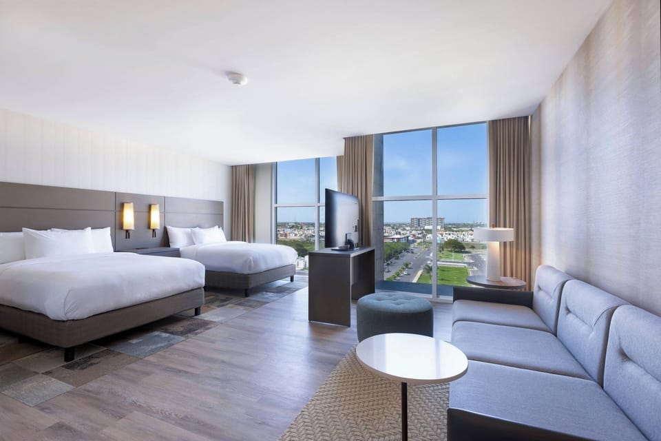 Studio, 2 Queen Beds, City View | In-room safe, laptop workspace, blackout drapes, soundproofing