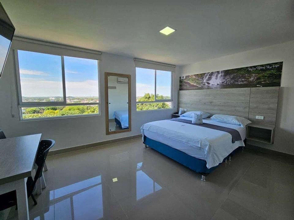 Deluxe Double Room, 1 Queen Bed | Pillowtop beds, desk, laptop workspace, WiFi (free)