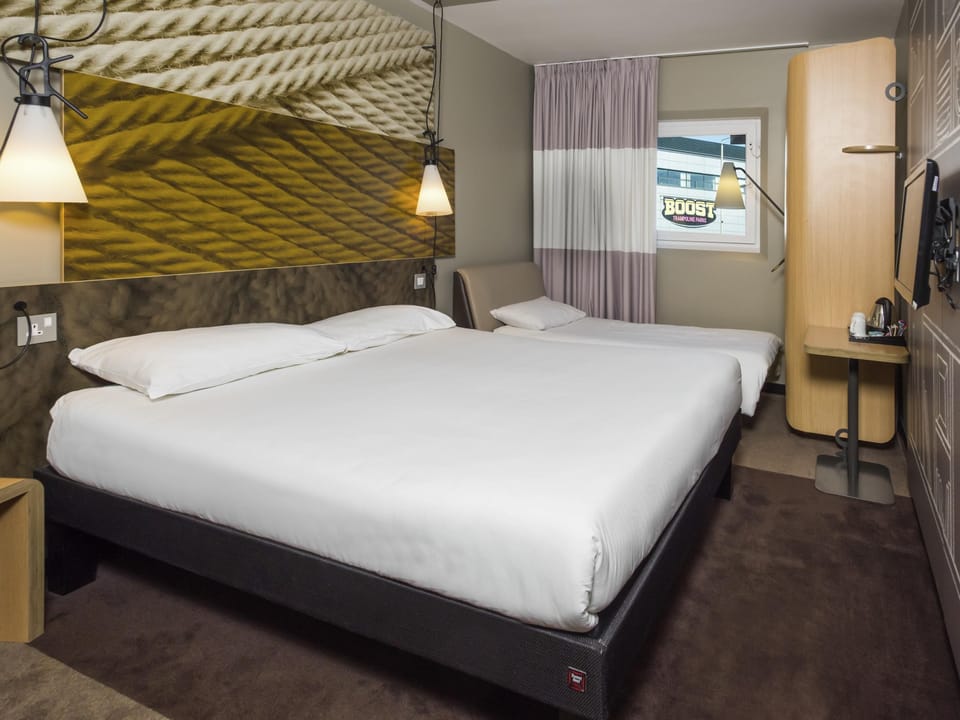 Family Room, Multiple Beds | Blackout drapes, free WiFi, bed sheets, alarm clocks