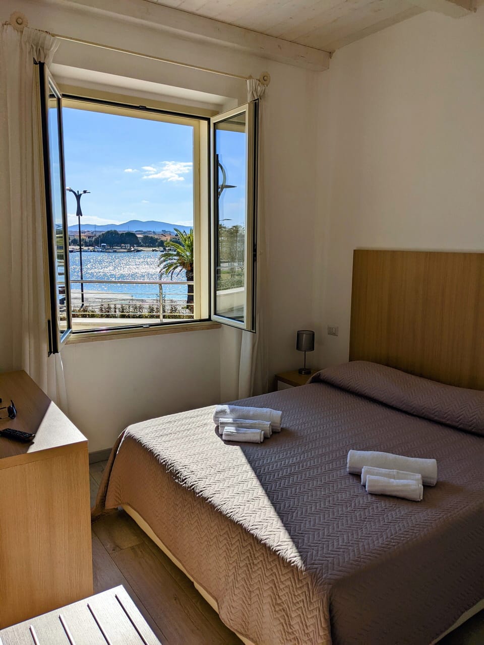 Deluxe Quadruple Room, 2 Bedrooms, Sea View | Minibar, in-room safe, desk, laptop workspace