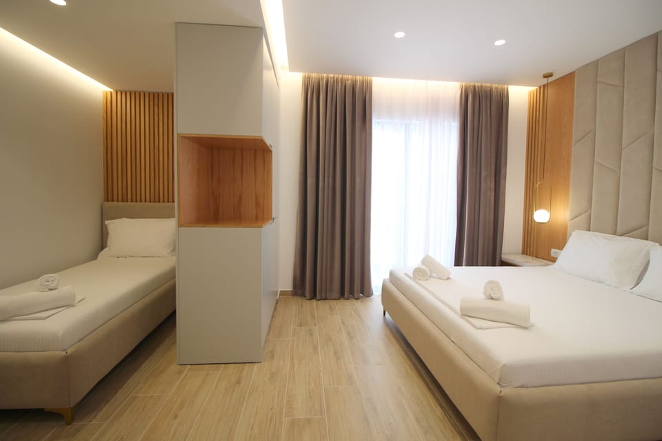Deluxe Quadruple Room, City View, Beachside | Premium bedding, memory foam beds, minibar, in-room safe