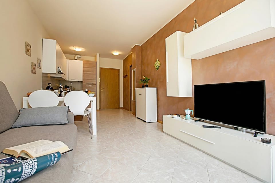 Family Apartment, 1 Bedroom, Microwave (Casa Kristall Lago) | Living area | 21-inch flat-screen TV with cable channels, TV
