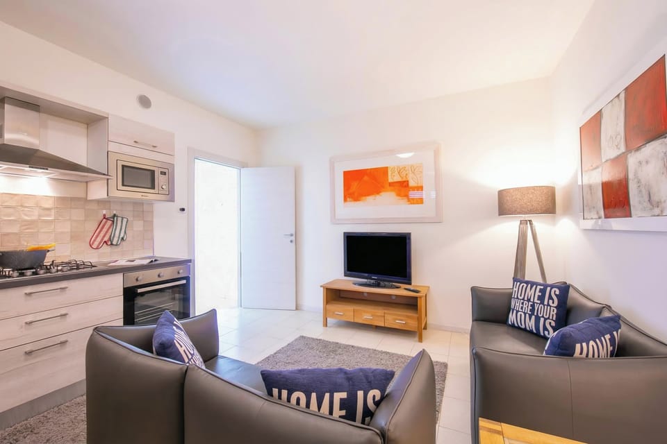 Standard Apartment, 2 Bedrooms, Balcony (Casa dei Quadri) | Living area | Flat-screen TV