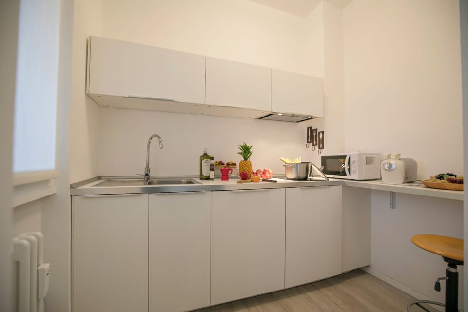 Family Apartment, 1 Bedroom, Microwave, Lakeside (Casa Del Lago in Desenzano Centre) | Private kitchen | Coffee/tea maker, full-size fridge, microwave, stovetop