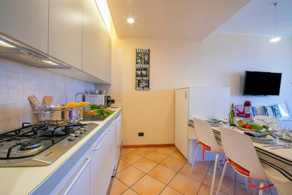 Family Apartment, Multiple Bedrooms (Appartamento Vista Lago) | Private kitchen | Full-size fridge, microwave, stovetop, dishwasher