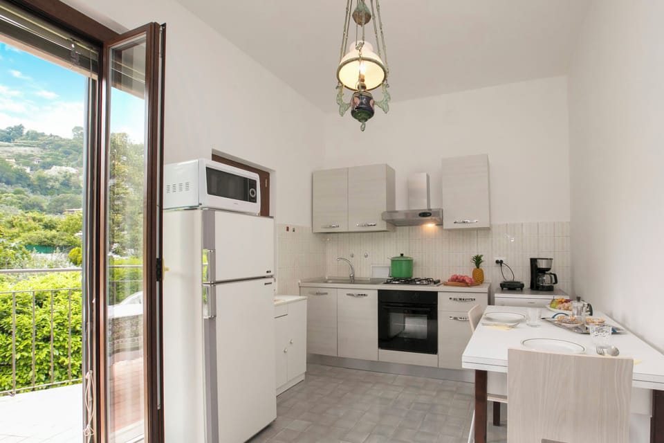 Family Villa, Multiple Bedrooms (Villa Alberti 900m from Garda lake) | Private kitchen | Full-size fridge, microwave, oven, stovetop