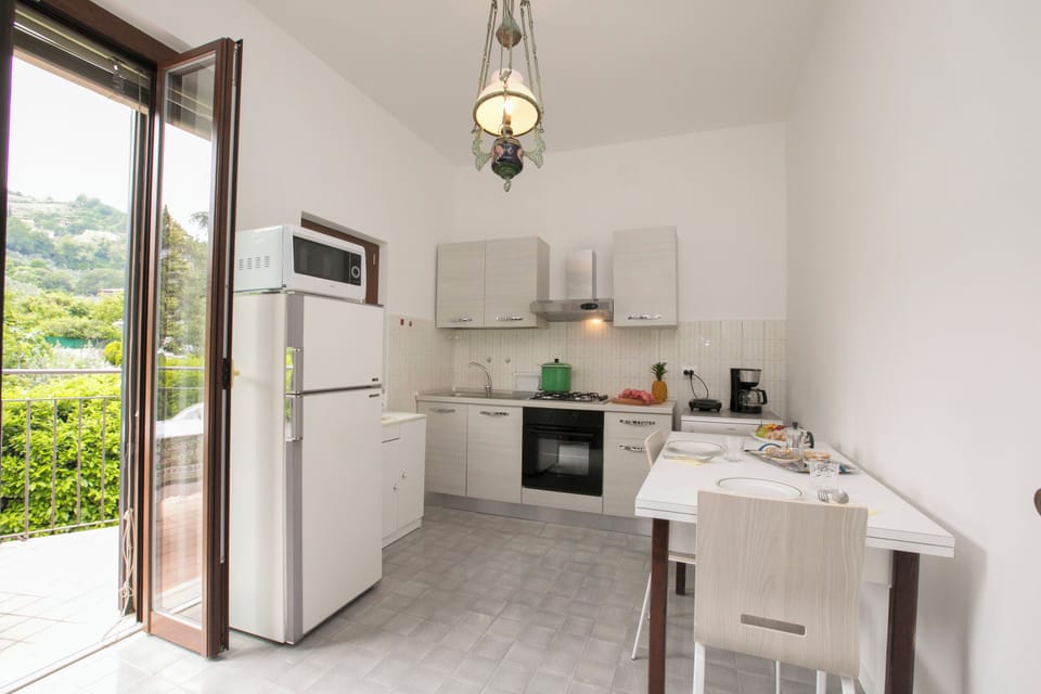 Family Villa, Multiple Bedrooms (Villa Alberti 900m from Garda lake) | Private kitchen | Full-size fridge, microwave, oven, stovetop