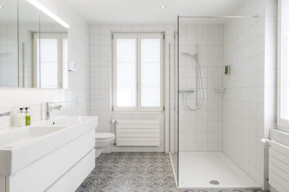 Separate tub and shower, designer toiletries, hair dryer, bathrobes