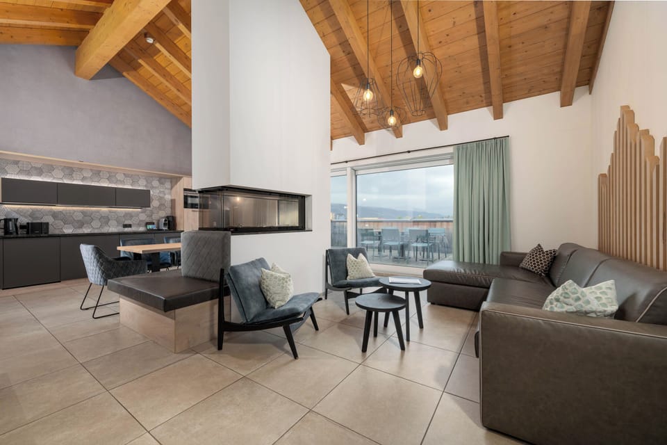 Penthouse, 4 Bedrooms | Living area | 32-inch flat-screen TV with cable channels