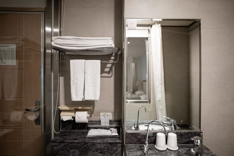 Shower, free toiletries, hair dryer, slippers