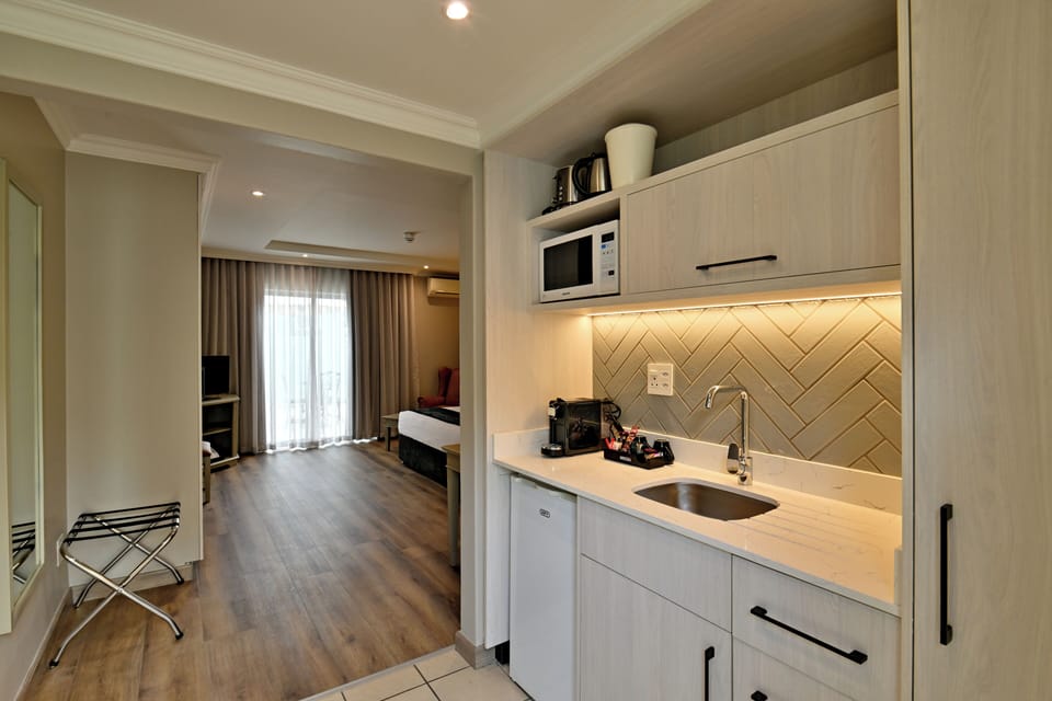 Fridge, microwave, electric kettle, cookware/dishes/utensils