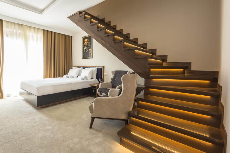 Executive Duplex | Premium bedding, minibar, soundproofing, iron/ironing board