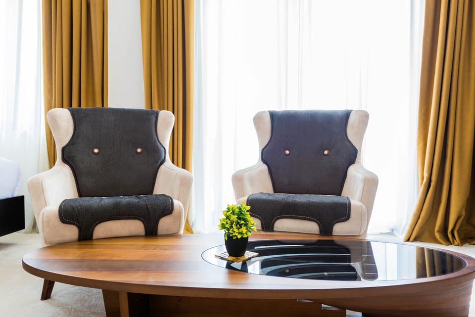 Comfort Quadruple Room | Living area | TV