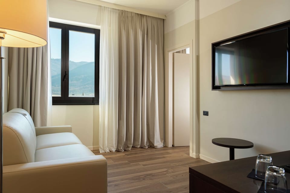 Suite, 1 Bedroom | Minibar, in-room safe, desk, laptop workspace