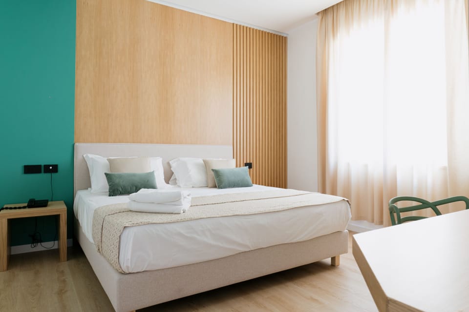 Junior Double Room | Minibar, in-room safe, individually decorated, desk