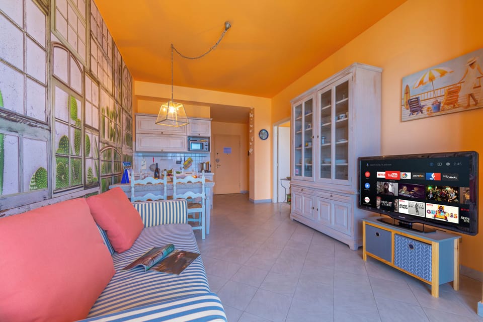 Family Apartment, Multiple Bedrooms, Sea Facing (Laigueglia Beach) | Living area | 22-inch flat-screen TV with cable channels, TV