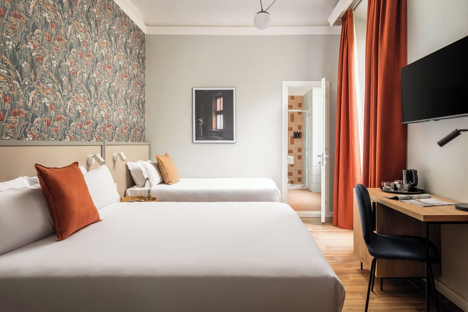 Triple Room | Minibar, desk, blackout drapes, iron/ironing board