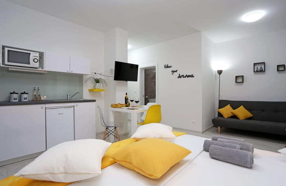 Exclusive Studio Suite | Living area | 81-cm LCD TV with satellite channels, TV