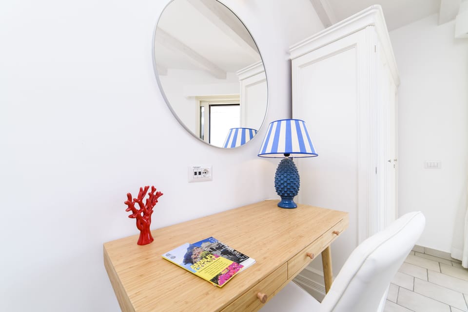 Deluxe Room, Terrace, Sea View | Minibar, individually decorated, individually furnished, desk