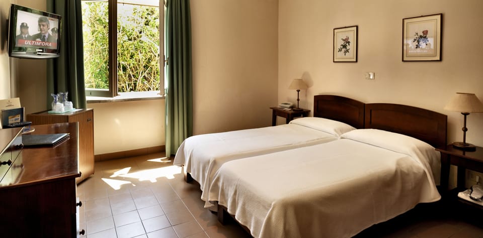 Standard Double or Twin Room | Minibar, in-room safe, desk, blackout drapes