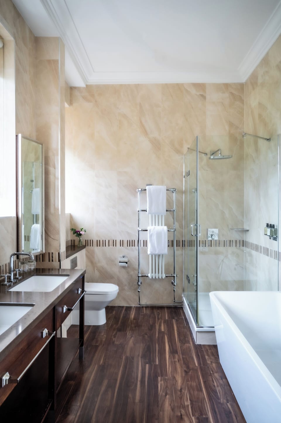Combined shower/tub, designer toiletries, hair dryer, slippers