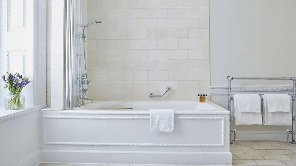 Combined shower/tub, designer toiletries, hair dryer, bathrobes