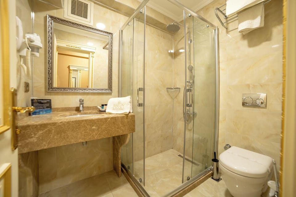 Shower, free toiletries, hair dryer, slippers