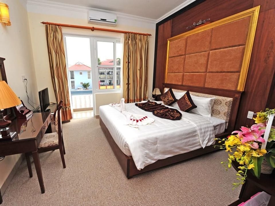 Minibar, desk, laptop workspace, iron/ironing board