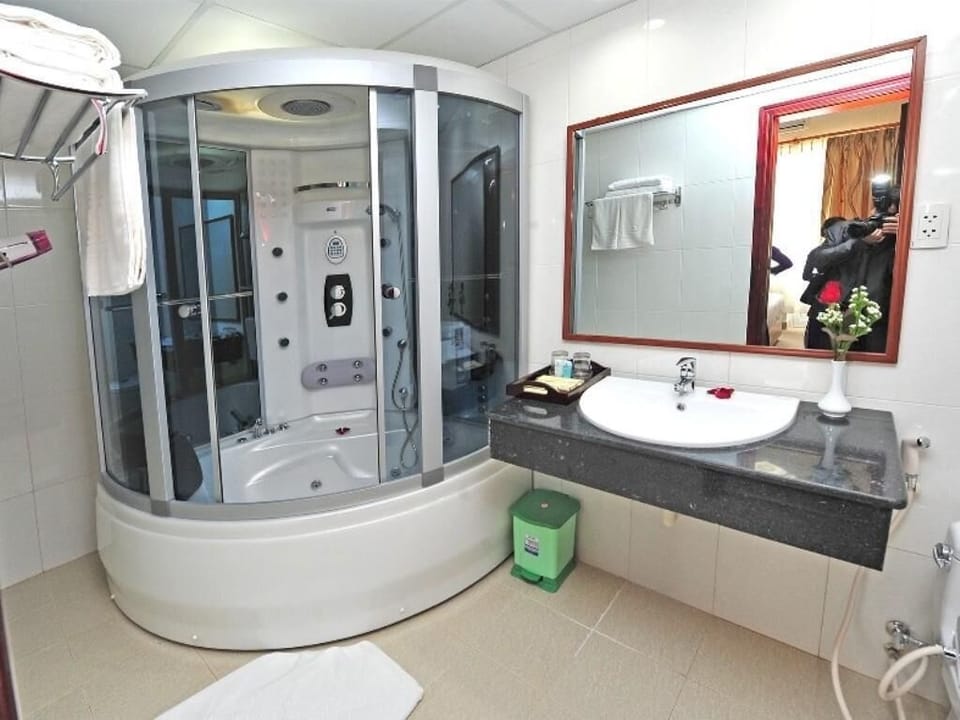 Shower, free toiletries, hair dryer, slippers