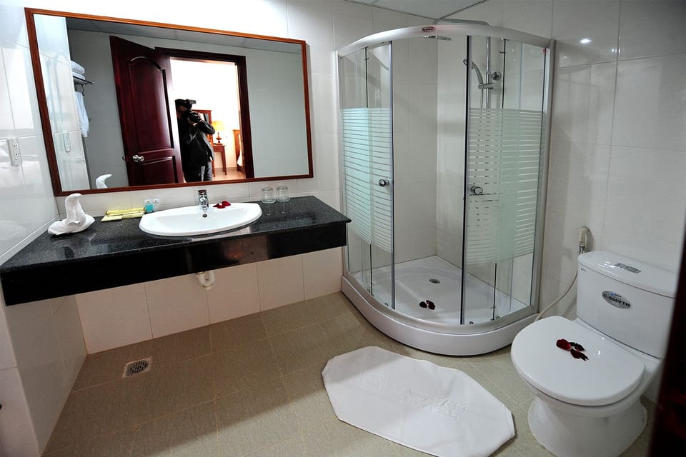 Shower, free toiletries, hair dryer, slippers