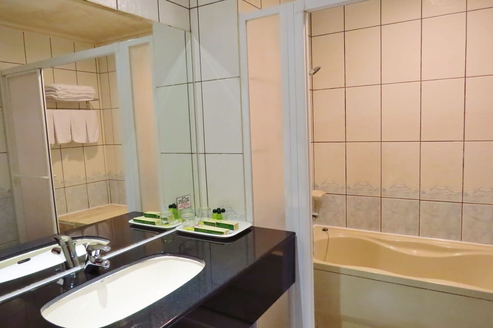 Superior Quadruple Room, 2 Queen Beds, Bathtub | Bathroom | Free toiletries, hair dryer, slippers, towels