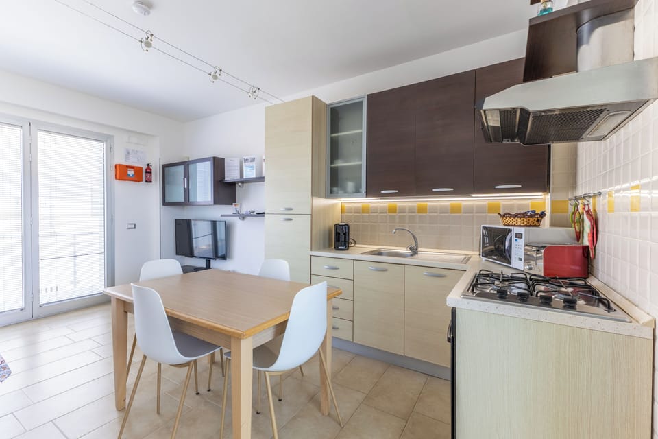 Apartment, 2 Bedrooms, Smoking, Balcony | Private kitchen | Coffee/tea maker, electric kettle, dining tables