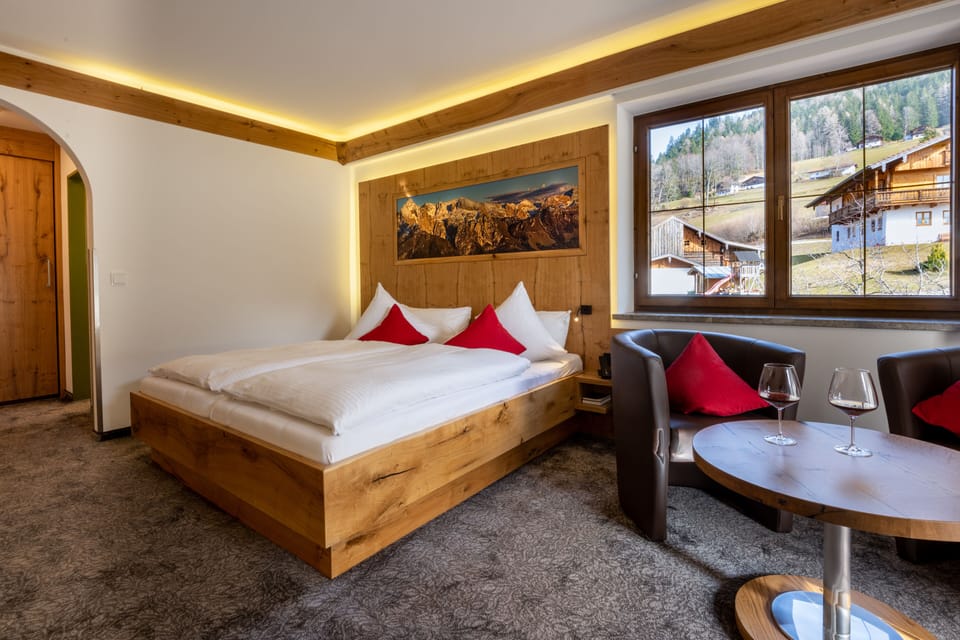 Superior Double Room with Balcony East | Living area | Flat-screen TV