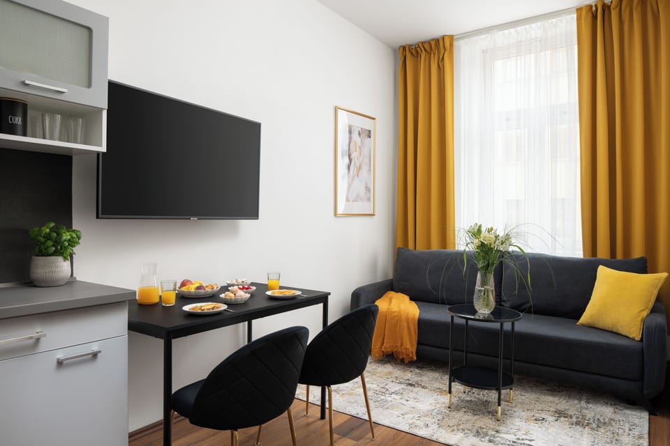 Comfort Apartment | Living area | TV