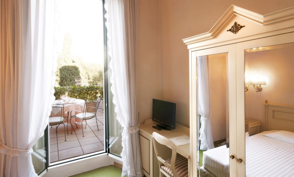 Classic Single Room, City View | Minibar, in-room safe, individually furnished, desk