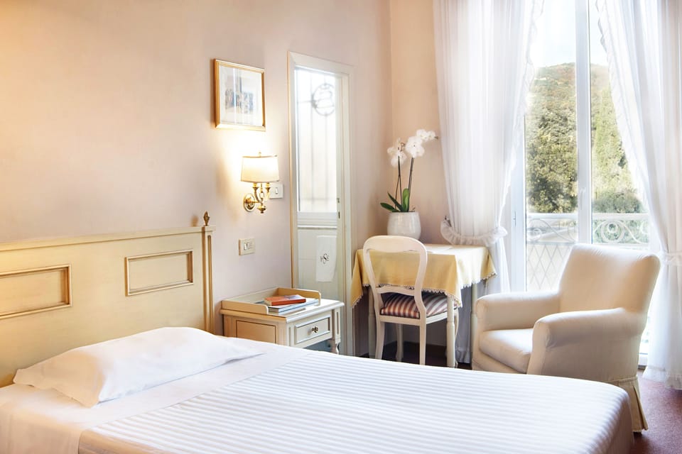 Classic Single Room, City View | Minibar, in-room safe, individually furnished, desk