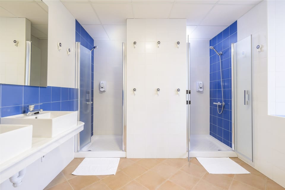 Room, 1 Bedroom, Accessible (1 bed in a 10-Bed Dormitory Room) | Bathroom | Shower, towels, soap, shampoo