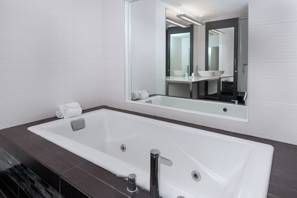 aloft, Suite, 1 King Bed, City View | Bathroom | Shower, designer toiletries, towels