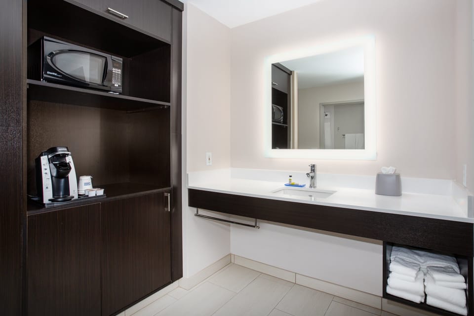 Designer toiletries, hair dryer, towels, soap