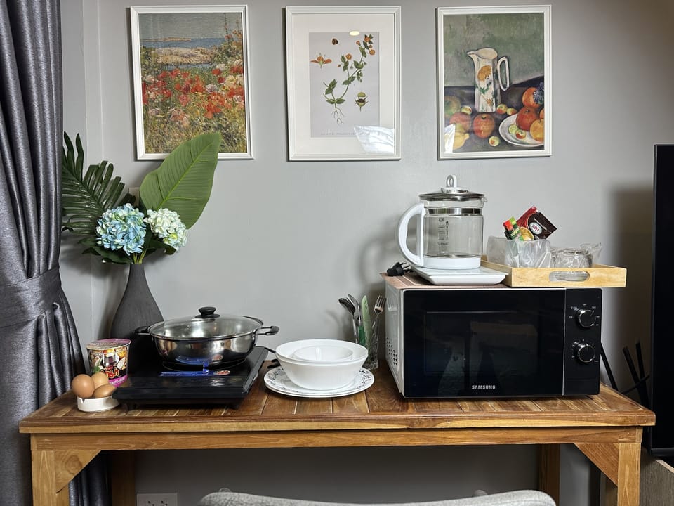 Mini-fridge, electric kettle, cookware/dishes/utensils