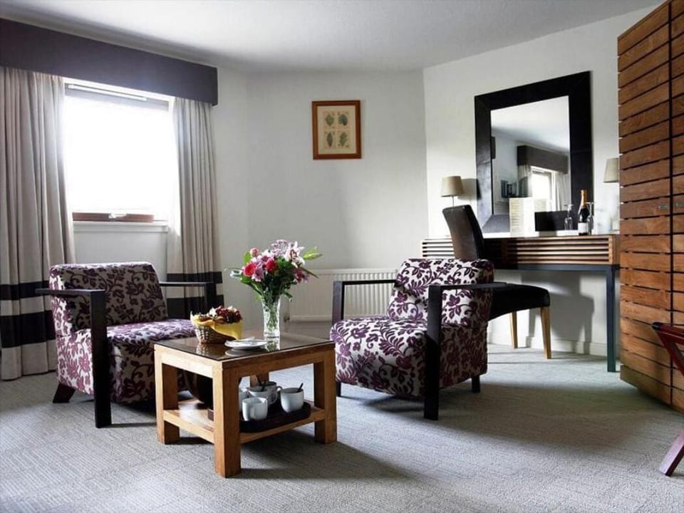 Premium bedding, desk, laptop workspace, iron/ironing board