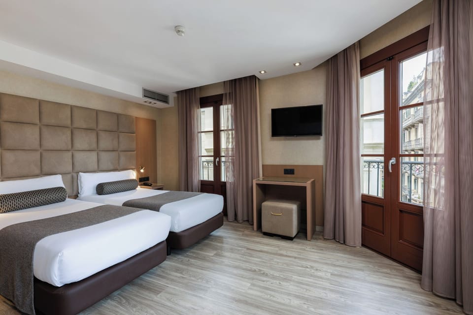 Quadruple Room | Down comforters, in-room safe, desk, soundproofing