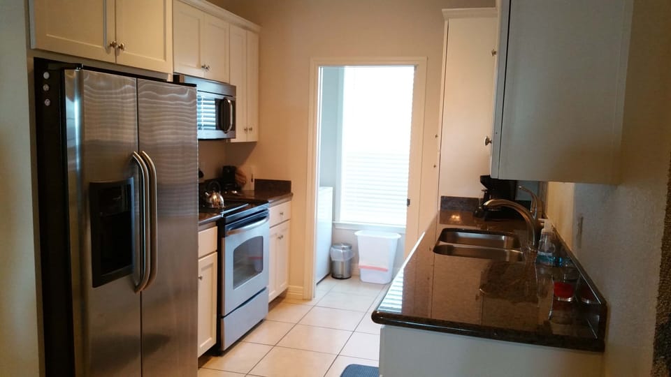 Condo, 2 Bedrooms, 2 Bathrooms | Private kitchen | Full-size fridge, microwave, oven, stovetop