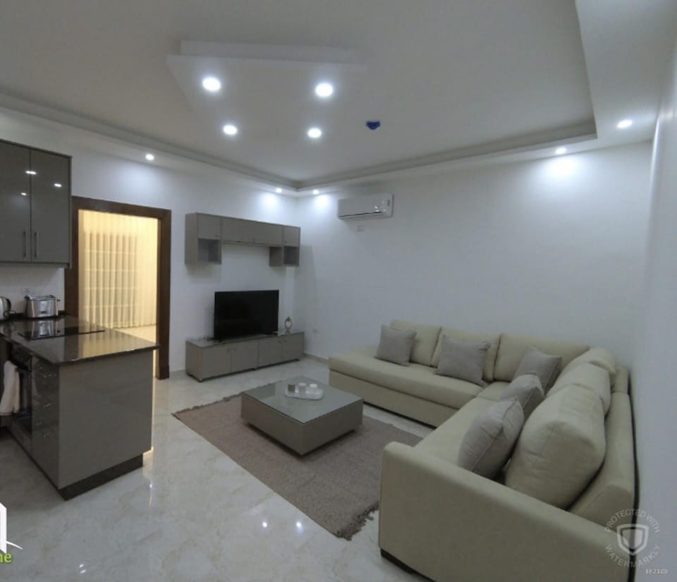 Apartment | Living area | 30-inch TV with digital channels