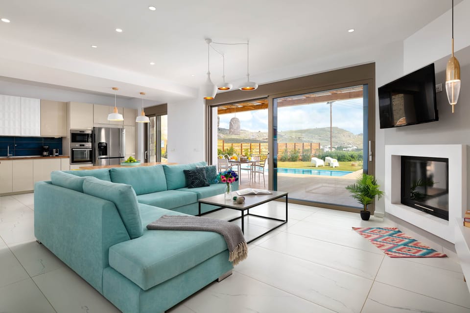 Villa, 3 Bedrooms, Private Pool | Living area | 40-inch flat-screen TV with satellite channels, TV, fireplace