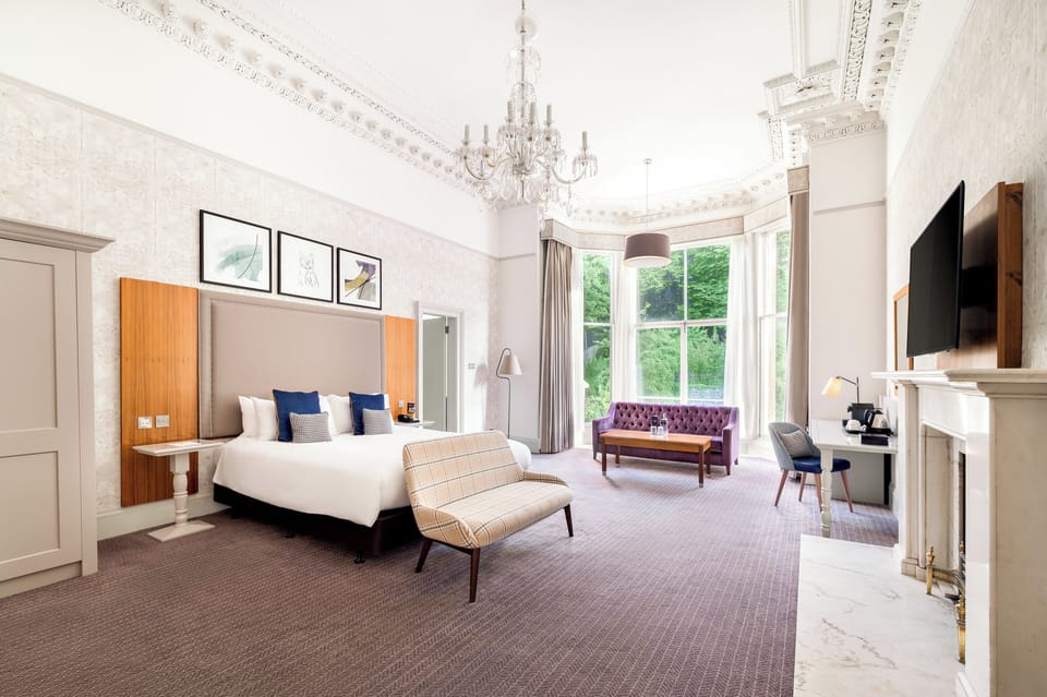 Suite, 1 King Bed | In-room safe, desk, iron/ironing board, free cribs/infant beds