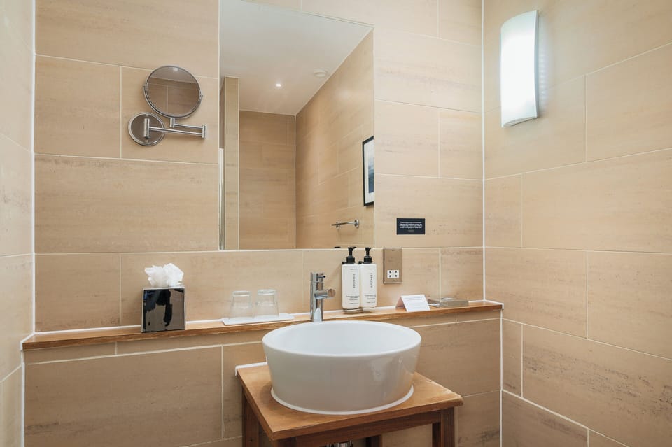 Combined shower/tub, free toiletries, hair dryer, slippers