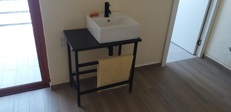 Desk, laptop workspace, blackout drapes, iron/ironing board