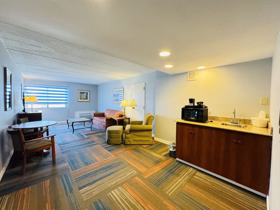 Suite, 1 King Bed with Sofa bed | Living area | Flat-screen TV