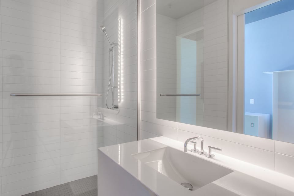 Shower, designer toiletries, hair dryer, bathrobes